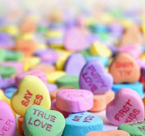 Photo of Candy Hearts for Valentine's Day with typical Valentine's Day expressions. Photo by Laura Ockel from Unsplash