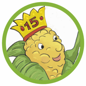 Illustration: Ein vermenschlichter Maiskolben mit einer goldenen Krone, auf der die Zahl 15 in roter Schrift prangt. Die Grafik ist kreisrund und hat eine grasgrüne Umrandung.